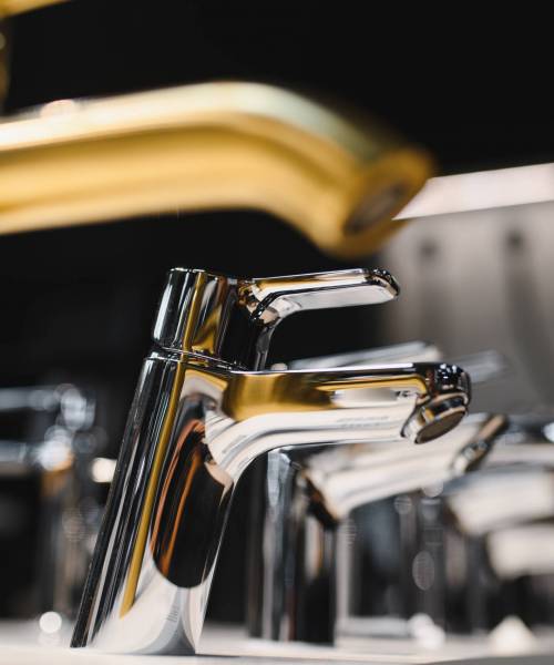 Modern kitchen and bathroom water faucets in the store.