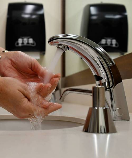washing-hands-in-a-public-restroom-bathroom-stop-2025-03-11-18-31-12-utc